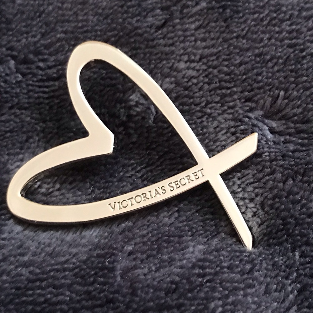 Silver tone Victoria’s Secret pin.